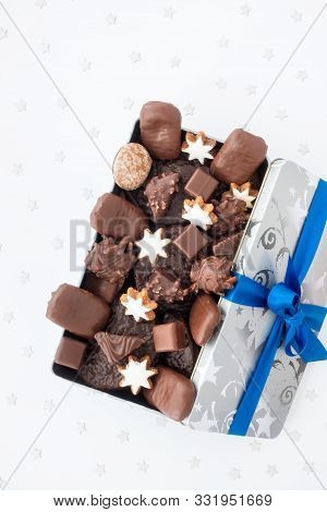 German Gingerbread Assortment And Aachener Printen In A Silver Christmas Cookie Tin On White Backgro