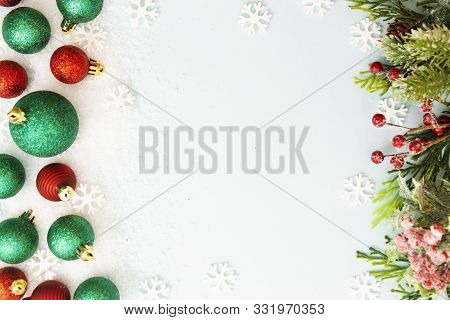 Christmas Glitered Green And Red Baubles, Balls Isolated On Snow. Winter Abstract Border Mockup. Cop