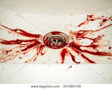 Blood Stains In Bathroom In White Ceramic Sink, Bleeding, Criminal And Suicide Concept. Splashes Of 