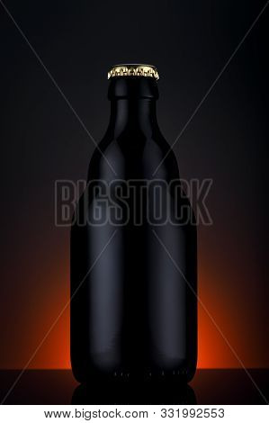 Bottle Of Beer On A Gradient Black Background
