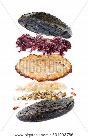 Delicious Hamburger With Flying Ingredients Isolated On White Background. Freshly Burger With Fish C
