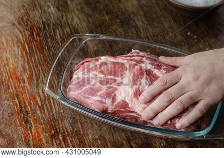 Homemade Capicola Or Coppa. Dry-cured Pork Loin Step-by-step Recipe. A Man Is Massaging A Large Piec