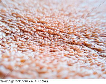 Macroshot Texture Of Orange Terry Cloth With Copy Space. Selective Focus Surface Of Fuzzy Towel. Thi