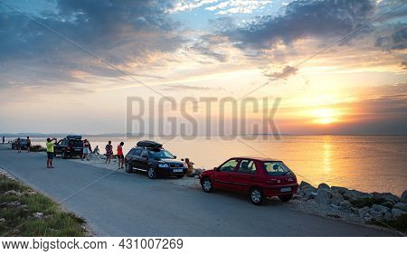 Vir, Croatia - July 28, 2021: Tourists Admire The Sunset On The Island Of Vir, Croatia.