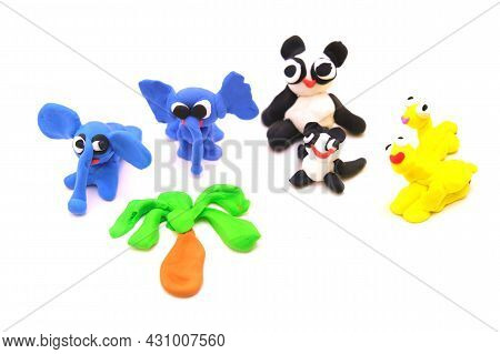 Child Made Funnny Animals Elephant, Panda And Other From Plasticine, Colorful Modeling Clay And Scul