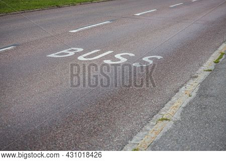Close Up View Of Bus Line Road Markings On Asphalt Road. Sweden.