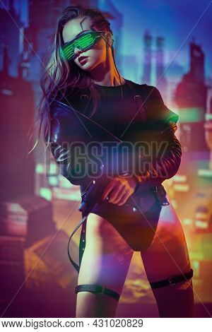 Game, virtual reality. A courageous cyberpunk girl warrior stands with a gun in her hands against the backdrop of the night city of the future. Cyberpunk concept.