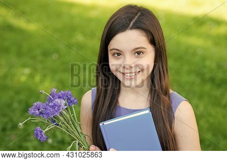 Happy Childrens Day. Happy Girl Got Flowers For Childrens Day. Little Child On Summer Outdoor. Child