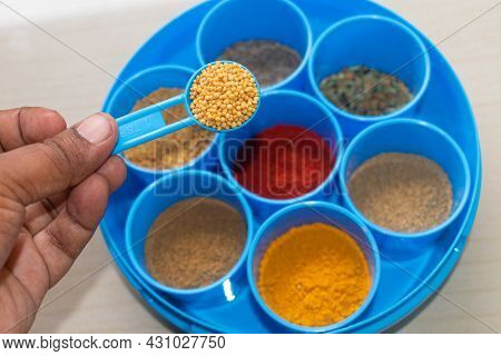 Heap Of Mustard Seeds Isolated On Verious Masala Background, Top View.