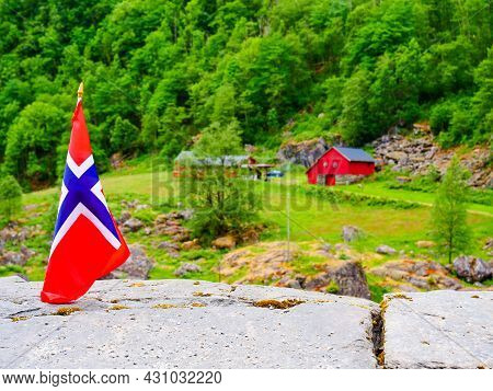Norwegian Flag Waving Outdoor On Green Nature