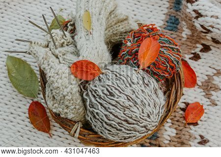Autumn Knitting Of Warm Clothes. Woolen Balls Of Knitting Needles. Self-made Things With Love. Idea 