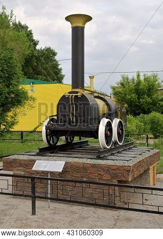 Novosibirsk, Siberia, Russia - 05.25.2020: Model Of One Of The First Steam Locomotives Created In Ru