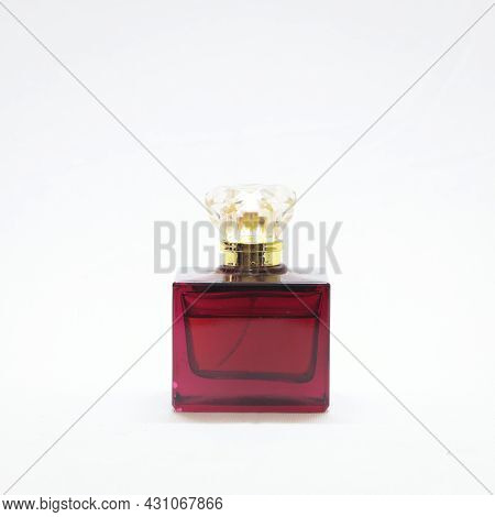 Expensive Luxurious Maroon Perfume Bottle Isolated In A White Background