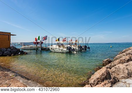 Group Of Small Motor Boats For Rent In Lake Garda, Small Port Of Cisano Village, Tourist Resort, Bar