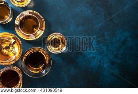 Strong Alcohol Drinks, Hard Liquors, Spirits And Distillates Iset In Glasses: Cognac, Scotch, Whiske