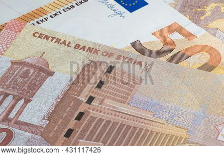 Syrian Pound Or Lira Together With Euro Banknote. Money Of The Arabic Country. Close Up Detailed Mon