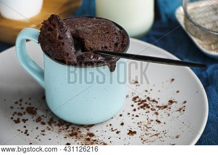 Mugcake Is Microwaved. Homemade Cupcake In A Mug Is On A Plate.