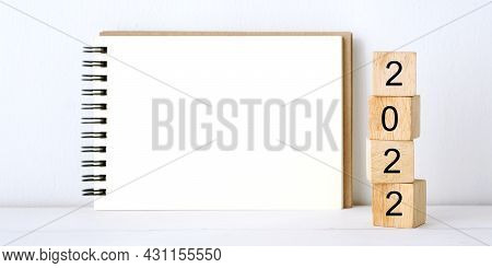 2022 On Wood Block, Blank Notebook Paper On White Table Background, 2022 New Year Mock Up, Template 