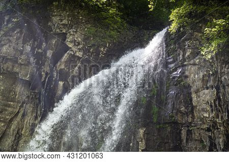 The Giant Waterfall In The Republic Of Abkhazia. A Clear Sunny Day On May 20, 2021