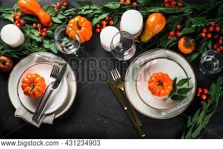 Autumn Table Setting With Plate, Pumpkin And Candles.