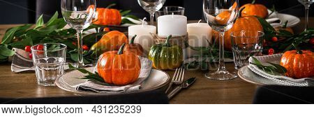 Autumn Table Setting With Plate, Pumpkin And Candles.
