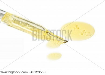 Liquid Oil Serum Drop In Pipette Isolated On White Background. Retinol, Aha, Bha Acid, Collagen Skin