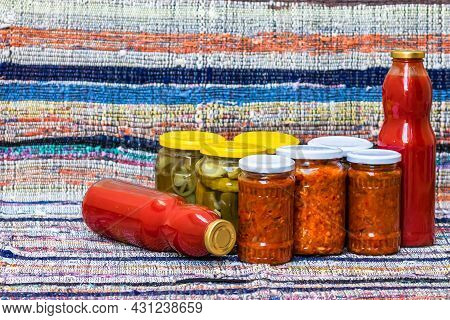 Glass Jars With Pickled Red Bell Peppers And Pickled Cucumbers (pickles) Isolated. Jars With Variety