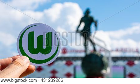 June 14, 2021 Wolfsburg, Germany. The Emblem Of The Football Club Vfl Wolfsburg Against The Backgrou