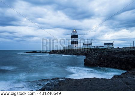 Hook Head, Wexford, Ireland, June, 2019. Hook Lighthouse At Wexford Ireland In A Cloudy Night.