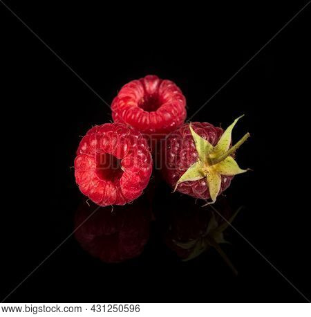 Raspberry Isolated. Raspberries With Leaf Isolate. Raspberry With Leaf Isolated On Black Background