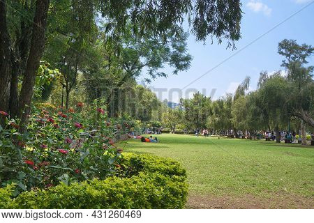 Tourists, Grassland, Flowers And Trees At Burnham Park In Baguio, Philippines, Southeast Asia. Photo