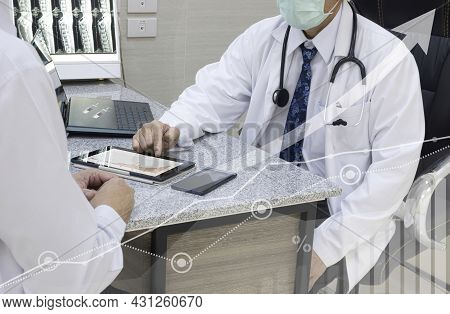 A Doctor Explaining To The Patient, The Benefits Of Taking A Two-shot Covid-19 Vaccination. Clinical
