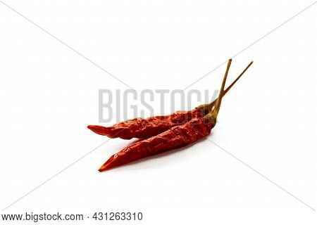 Dry Red Hot Chili Peppers On White Background