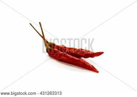 Dry Red Hot Chili Peppers On White Background