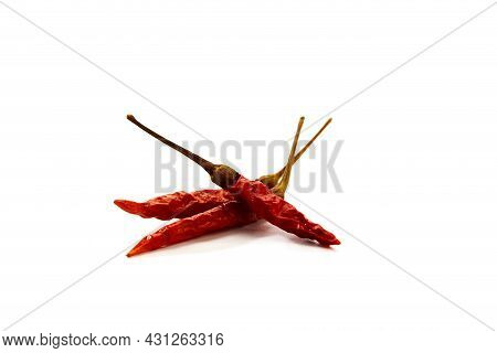 Dry Red Hot Chili Peppers On White Background