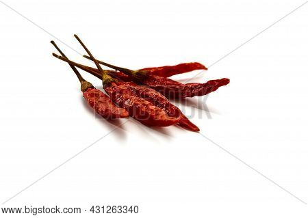 Dry Red Hot Chili Peppers On White Background
