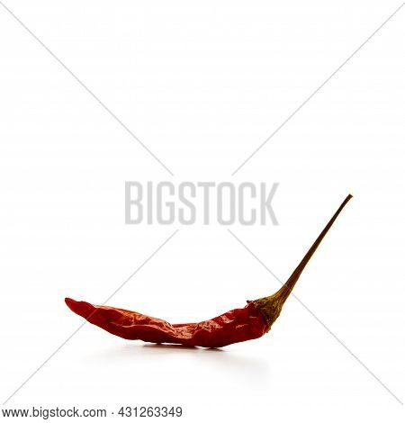 Dry Red Hot Chili Peppers On White Background