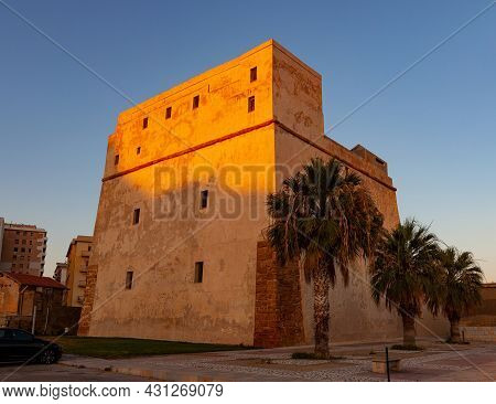 View Of The Fortress Also Called Tower Of Charles V At Sunset In Porto Empedocle. Sicily
