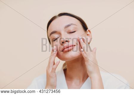 Young Caucasian Woman Doing Facebuilding Yoga Facial Gymnastics Self Lymph Facelift Massage.