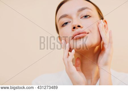 Young Caucasian Woman Doing Facebuilding Yoga Facial Gymnastics Self Lymph Facelift Massage.