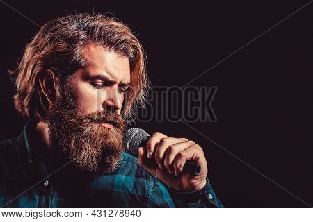 Man Singing With Microphone. Male Singing With A Microphones. Bearded Man In Karaoke Sings A Song In