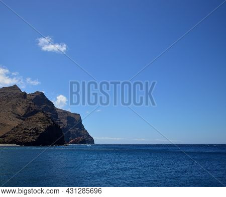 High Cliffs, Calm Sea And Splendid Blue Sky, Coast Of La Aldea, Gran Canaria, Canary Islands