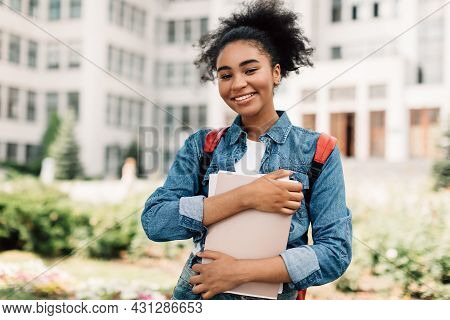 Happy African American Teenager Girl Posing Near Modern University Building