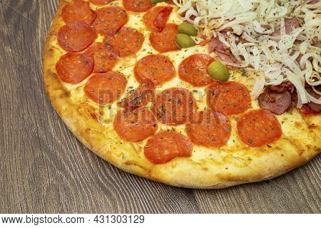 Peperoni Pizza Seen From Above. With Olives. And Delicious Ingredients.