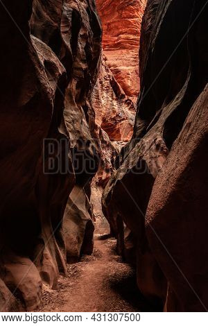 Deep Orange Wall Rises At The End Of A Narrow Corridoor Of Buckskin Gulch In Utah