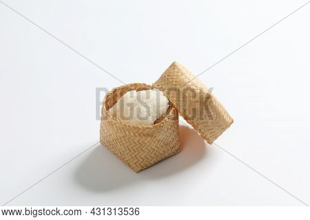 Steamed Sticky Rice Is In Bamboo Container On White Background.