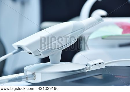 Dental Intraoral Scanner On Table In Modern Dentist Office. Dentistry And Health Care Concept. Close