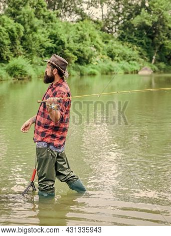 The Best Time To Go Fishing. Summer Weekend. Big Game Fishing. Mature Man Fly Fishing. Man Catching 