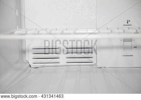 Empty Shelves Inside A Clean, Empty, White Refridgerator