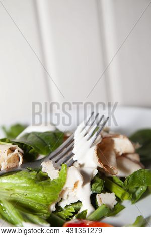 Romaine Lettuce, Tomato, And Chicken Lunchmeat Drizzled In Ranch Dressing